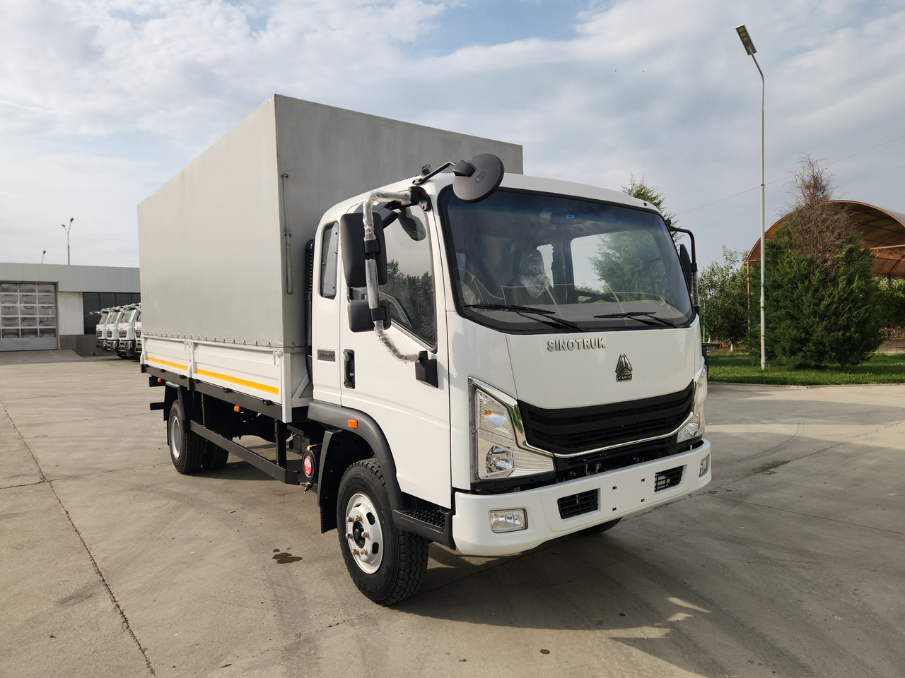 Бортовой автомобиль с тентом Homan-H3 4x2 - 6 т / 24 куб.м